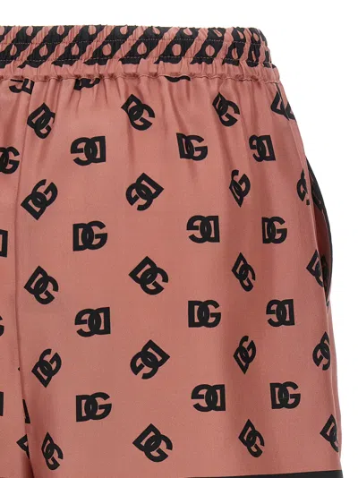 Dolce & Gabbana Pink Bermuda Shorts With Dg Logo Printed All-over In Silk Woman