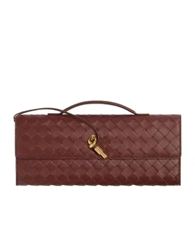 Bottega Veneta Travel Clutch With Woven Leather Handle In Red