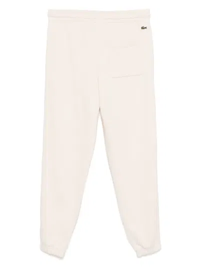 Lacoste Embossed Logo Pants In Beige
