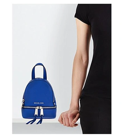 Shop Michael Michael Kors Rhea Extra-small Grained Leather Backpack In Cinder