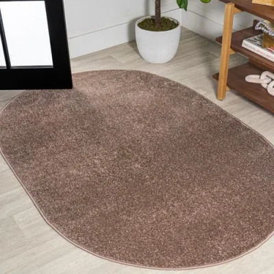 Jonathan Y Haze Solid Low-pile Oval Area Rug In Brown/taupe