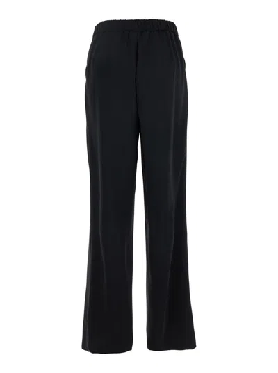 Plain Black Pants With Elastic Rear Waist And Wide Leg In Tech Fabric Woman In Black
