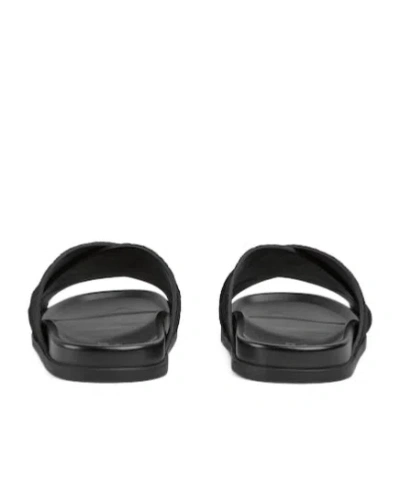 Gucci Men Leather Slides With All-over Gg Motif In Black