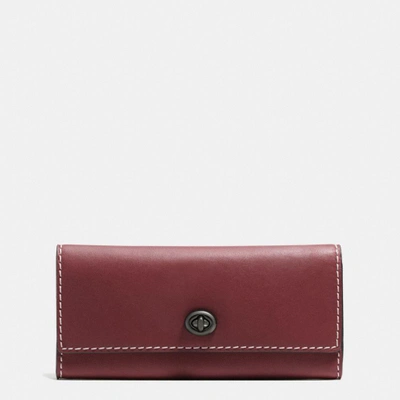 Coach Turnlock Wallet In Burnished Glovetanned Leather In : Black Copper/bordeaux