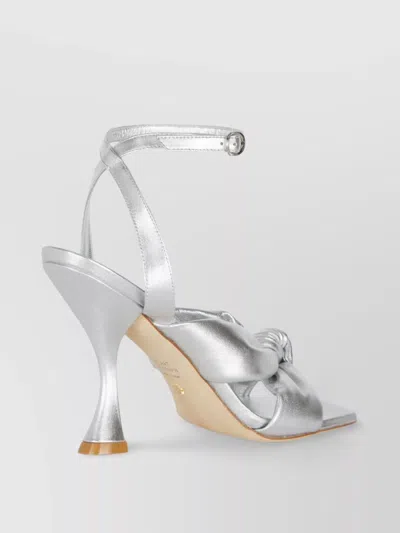 Stuart Weitzman Heeled Sandals With Knot Detail And Metallic Finish In Grey