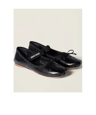 Miu Miu Logo-printed Bow Detailed Ballerina Shoes In Animal Print