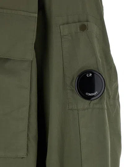 C.p. Company Green Jacket With Classic Collar And Logo Patch On The Sleeve In Green
