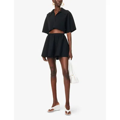 Alaïa Ribbed Flared Mid-rise Wool-blend Mini Skirt In Noir Alaia