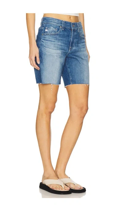 Ag Ex-boyfriend Distressed Raw Hem Mid Length Denim Shorts In 鸢尾花蓝