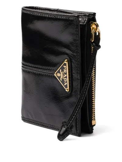 Prada Textured Leather Zip Wallet In Black