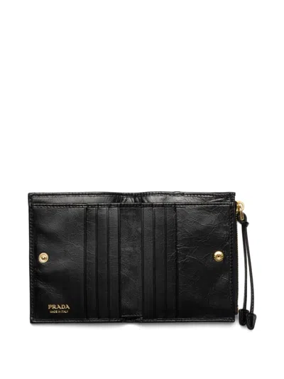Prada Textured Leather Zip Wallet In Black