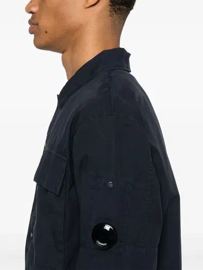 C.p. Company Blue Jacket With Classic Collar And Logo Patch On The Sleeve In Blue