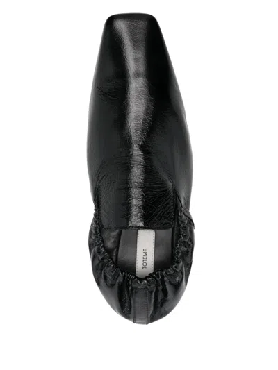 Totême Black Elastic-back Leather Loafers In Black 001