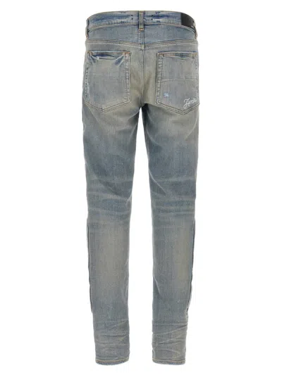 Amiri '3d Bones' Light Blue Jeans With 3d Detail On The Side And Logo Lettering On The Rear In Blue