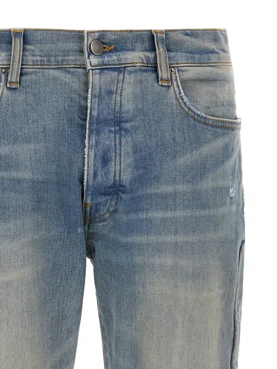 Amiri '3d Bones' Light Blue Jeans With 3d Detail On The Side And Logo Lettering On The Rear In Blue
