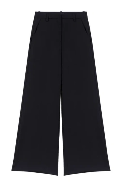Maje Flared Tailored Trousers In Black