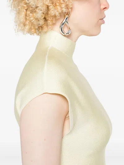 Khaite Andra Knit Peplum Top In Neutral