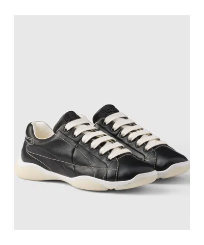Prada Handcrafted Leather Sneakers Geometric Stitching In Black