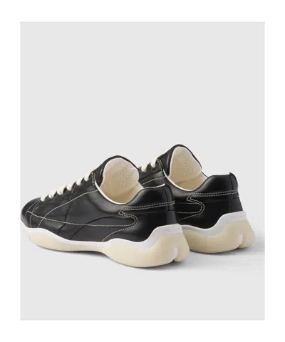 Prada Handcrafted Leather Sneakers Geometric Stitching In Black