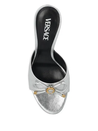 Versace Opera Bow 85 Metallic Leather Mules In Silver