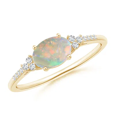 Angara Horizontally Set Oval Opal Ring With Trio Diamonds In Yellow Gold/milky With High Play Of Colour