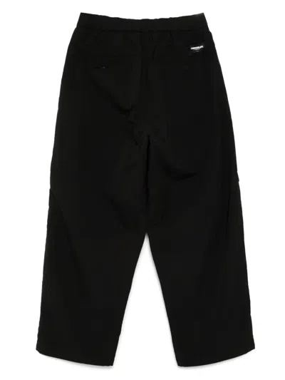 Chocoolate Logo-print Trousers In Black