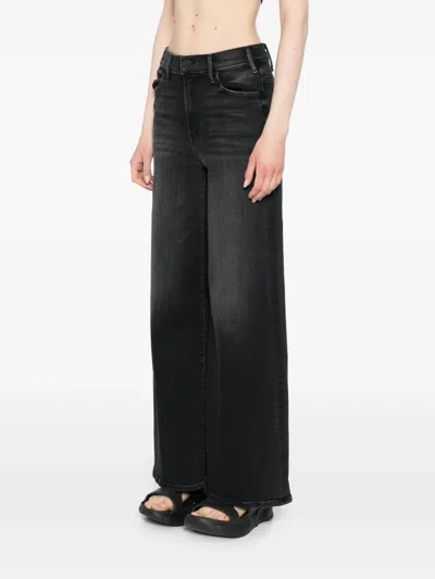 Mother The Roller Sneak Flared Jeans In Black