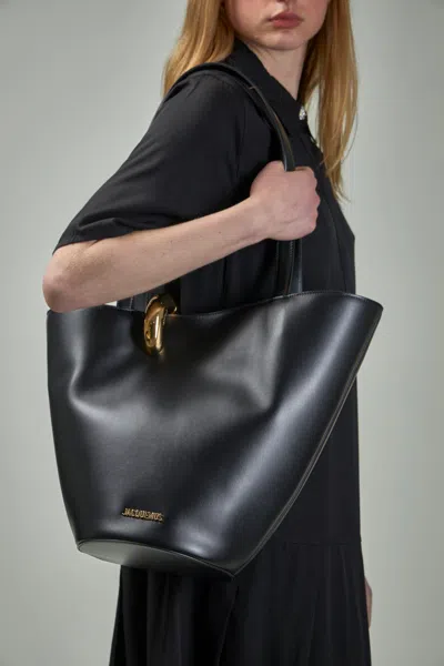 Jacquemus Le Petit Bambola Leather Top Handle Bag In Black