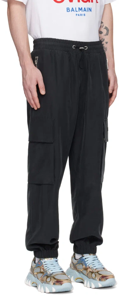 Balmain Embossed-logo Modal-blend Cargo Pants In Black