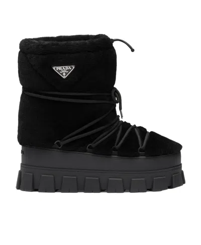 Prada Shearling And Rubber Ankle Boots With Fur Texture In Black