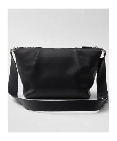 Prada Logo Print Leather Messenger Bag In Black
