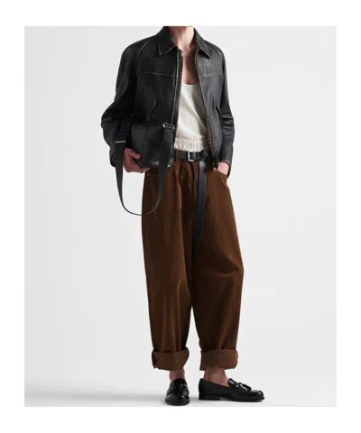 Prada Logo Print Leather Messenger Bag In Black