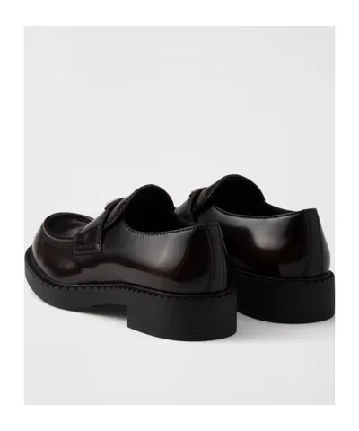 Prada Triangle Logo Chocolate Brushed Leather Loafers In Black