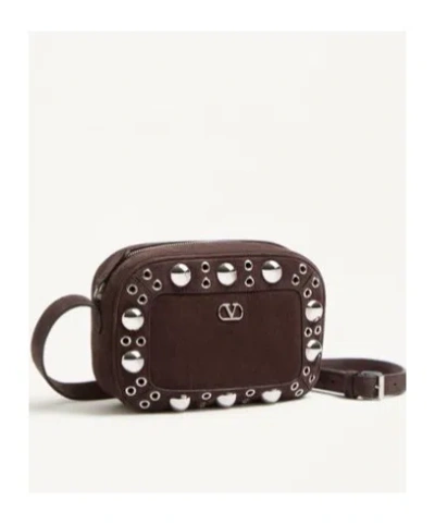 Valentino Garavani Dome-shaped Crossbody Bag With Metallic Eyelets And Adjustable Strap In Brown