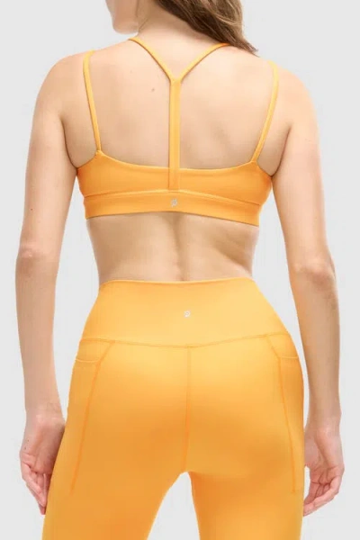 Peloton Cadent Strappy Y Back Bra In Amber