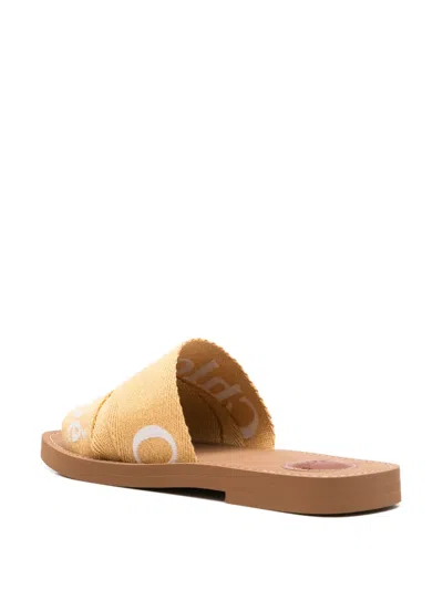 Chloé Woody Embroidery Flat Slides In Yellow