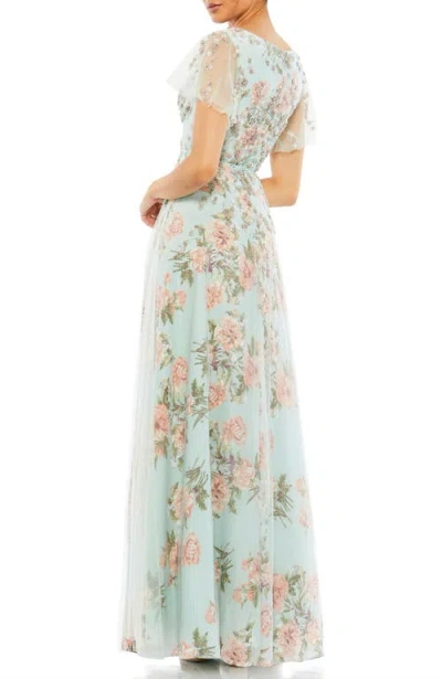 Mac Duggal Embellished Floral Gown With Mesh Flutter Sleeves And Beaded Waist In Blue Multi