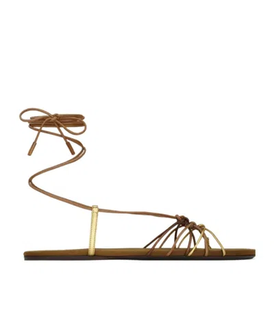Saint Laurent Cassandre Leather Flat Strappy Sandals In Gold