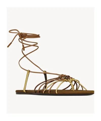 Saint Laurent Cassandre Leather Flat Strappy Sandals In Gold