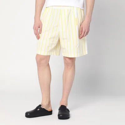 Shop Jacquemus White, Yellow Striped Bermuda Shorts With Logo