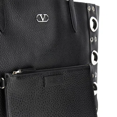 Valentino Garavani Handbags. In Black