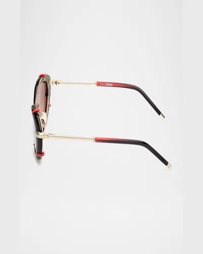 Christian Louboutin Spiked Oval Acetate Sunglasses In Shiny Black Front Shiny Pale Gold Red Gradient