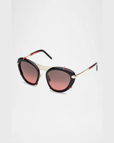 Christian Louboutin Spiked Oval Acetate Sunglasses In Shiny Black Front Shiny Pale Gold Red Gradient