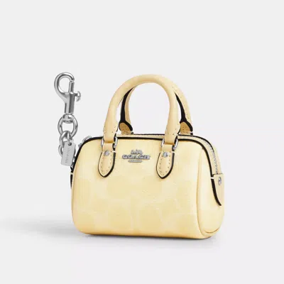 Coach Mini Rowan Bag Charm In Signature Canvas In Yellow
