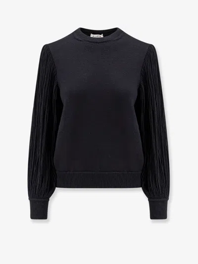 Alaïa Slit Fringe Sleeve Wool Crewneck Sweater