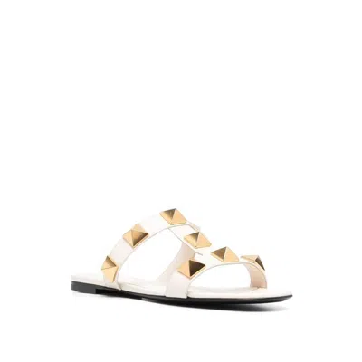 Valentino Garavani Roman Stud Flat Sandals With Signature Pyramid Studs In White