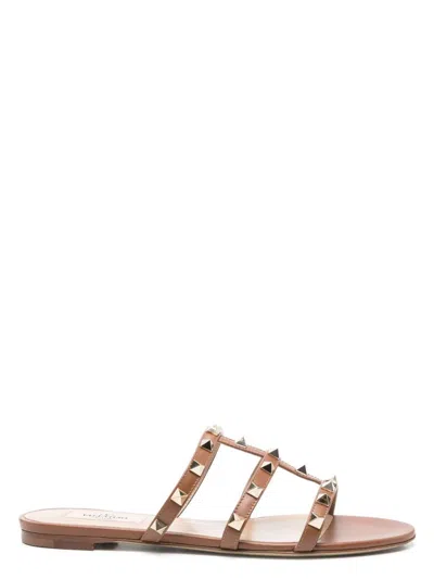 Valentino Flat Sole Rockstud Leather Sandals In Brown