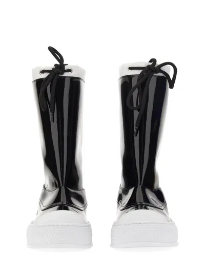 Moschino Glossy High-shaft Boots With Contrasting Sole In Black