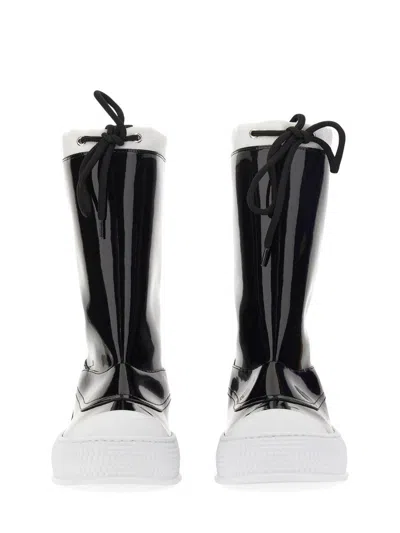 Moschino Glossy High-shaft Boots With Contrasting Sole In Black