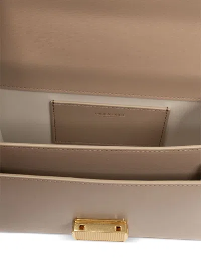 Golden Goose Deluxe Brand Structured Handbag With Gold-tone Clasp And Versatile Straps In Powder